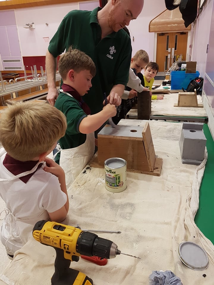 Daniel helps Paul make Bird Feeders